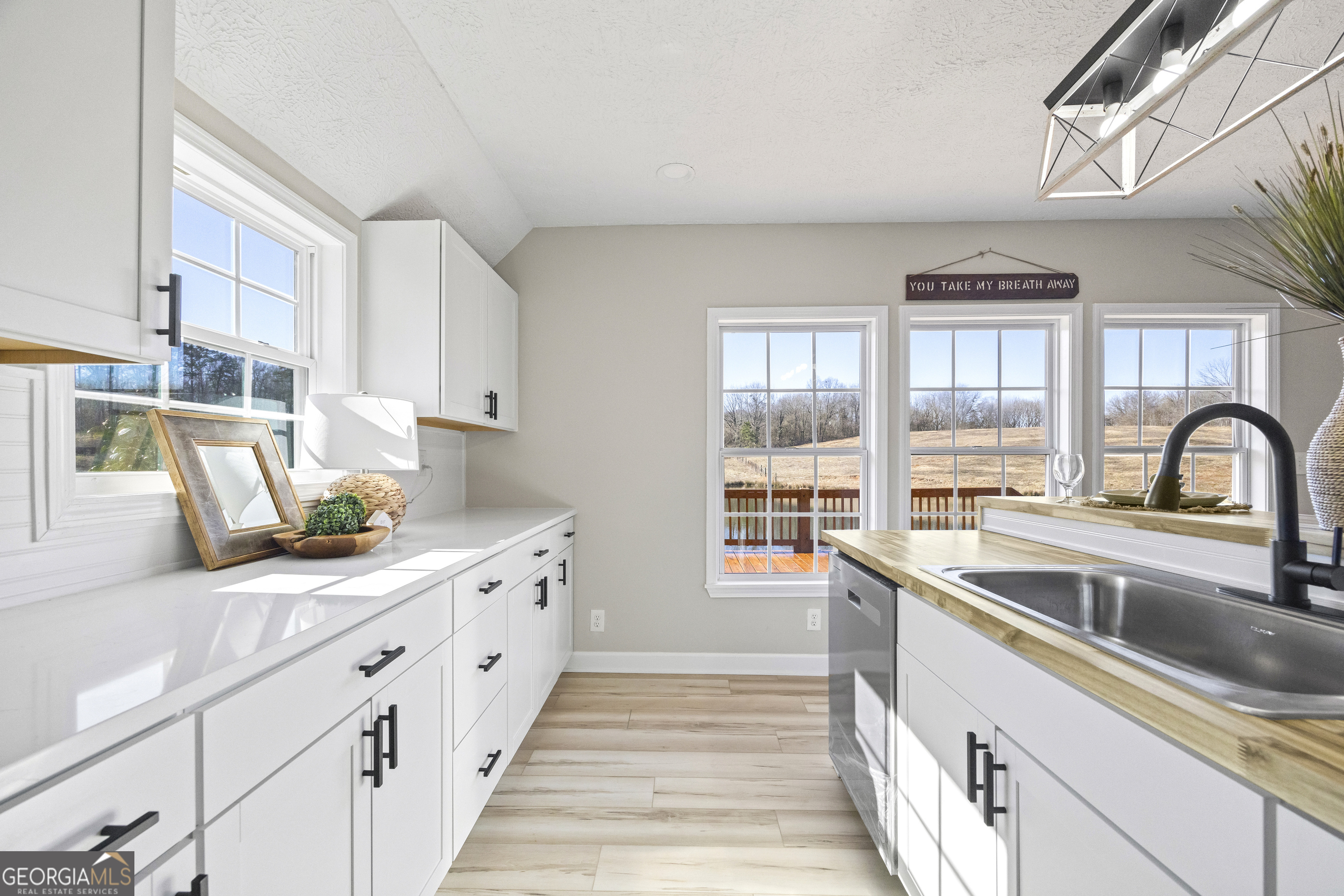 2894 Chase Road Cornelia, GA 30531 - Photo 53 of 142 a kitchen with stainless steel appliances granite countertop a sink and a stove