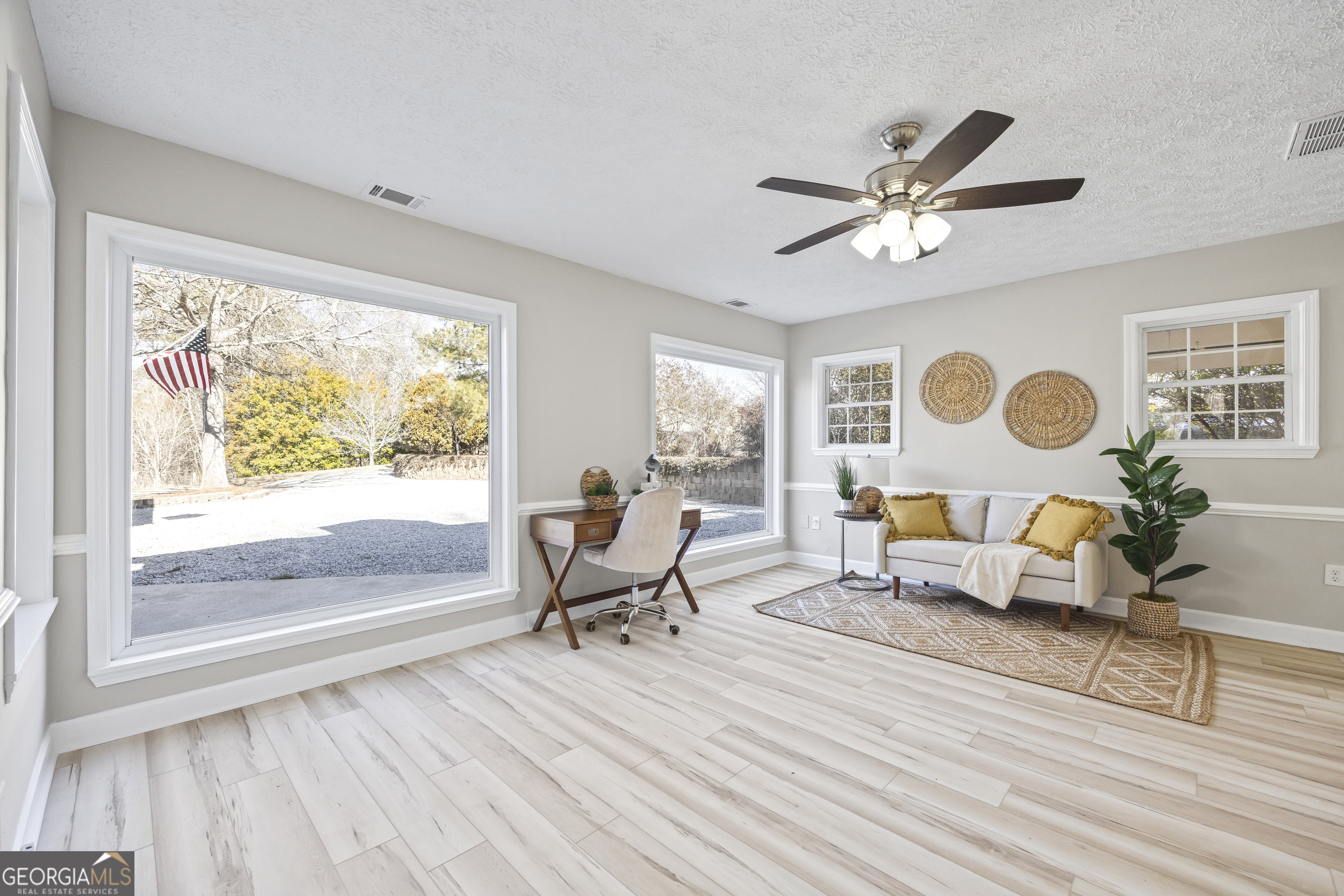 2894 Chase Road Cornelia, GA 30531 - Photo 60 of 142 a living room with furniture and a window