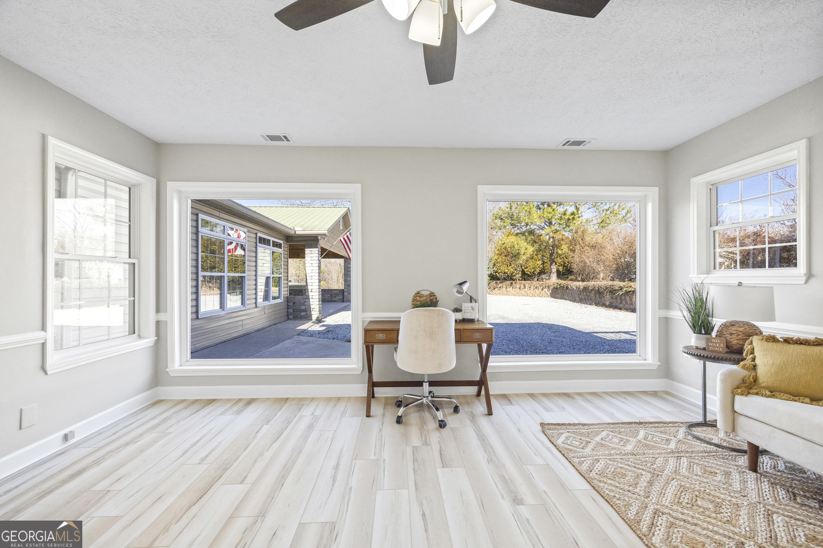 2894 Chase Road Cornelia, GA 30531 - Photo 63 of 142 a living room with furniture and a window
