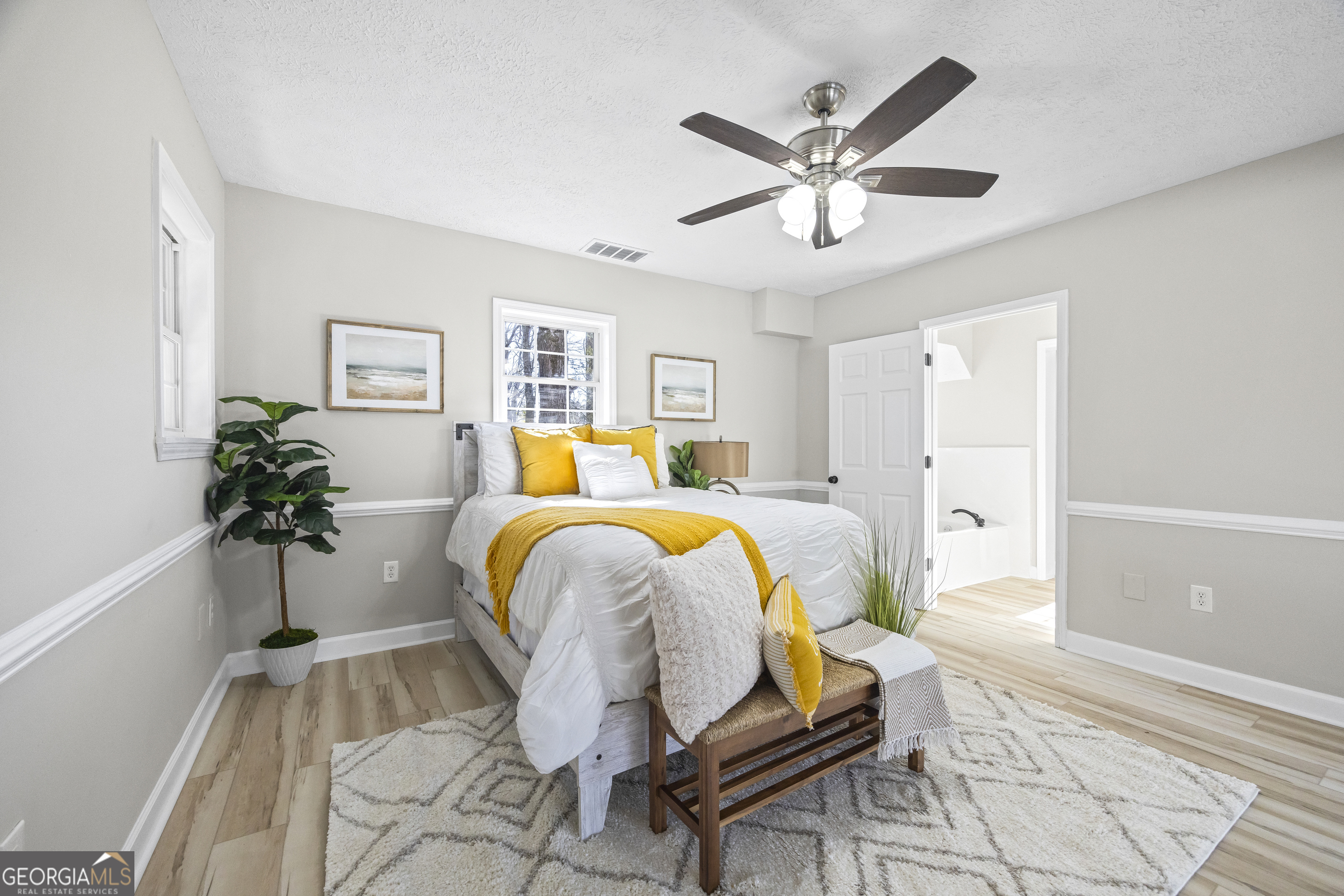 2894 Chase Road Cornelia, GA 30531 - Photo 65 of 142 a bed room with a bed and a potted plant