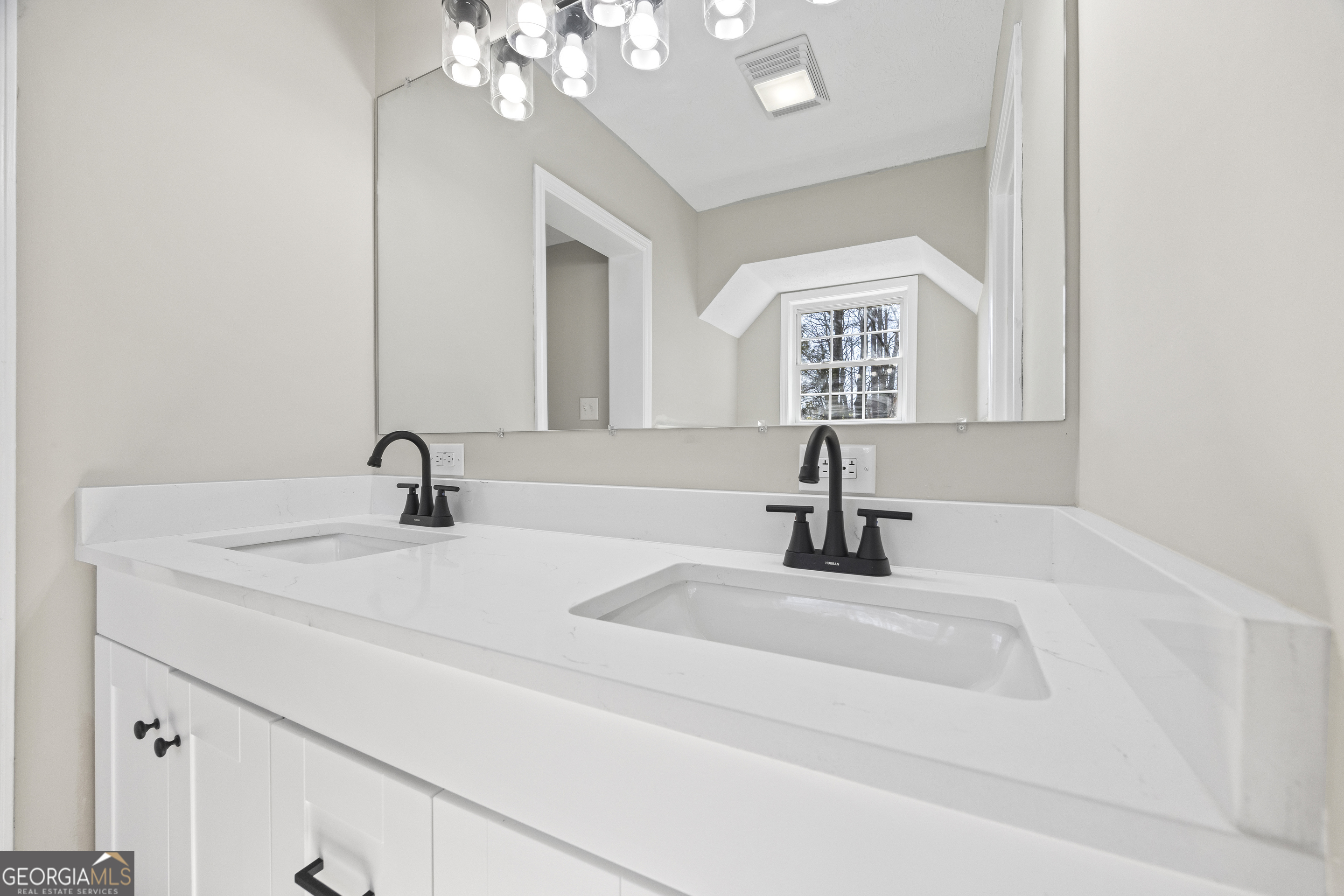 2894 Chase Road Cornelia, GA 30531 - Photo 68 of 142 a bathroom with a sink a mirror and vanity