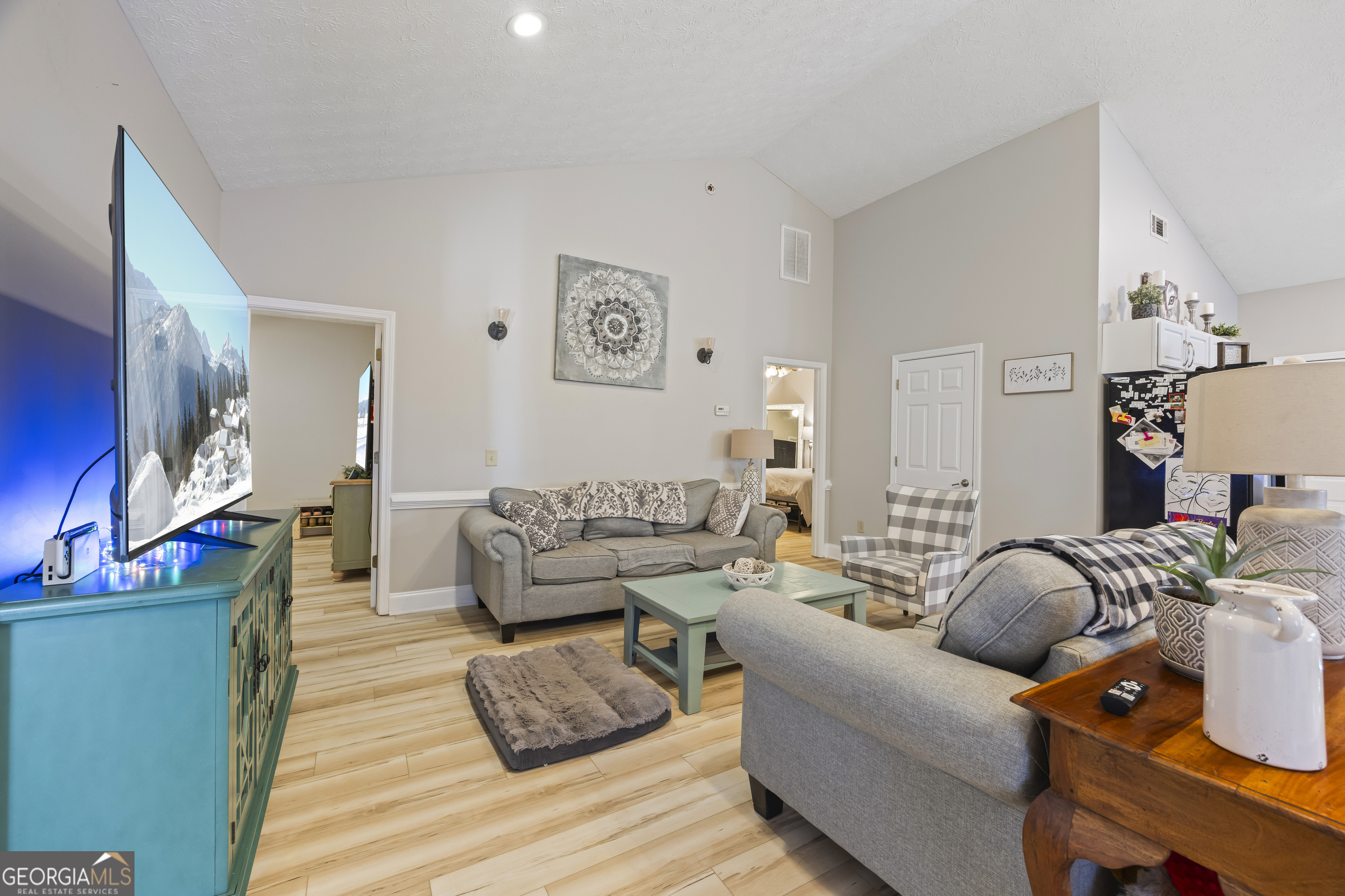 2894 Chase Road Cornelia, GA 30531 - Photo 98 of 142 a living room with furniture and a wooden floor