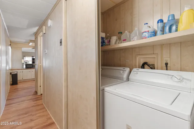 a view of hallway with washer and dryer