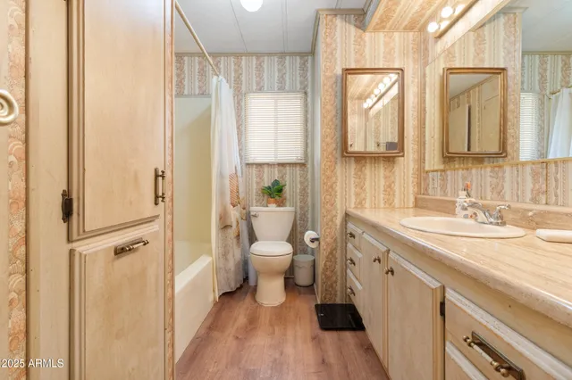 a bathroom with a double vanity sink a mirror and a shower