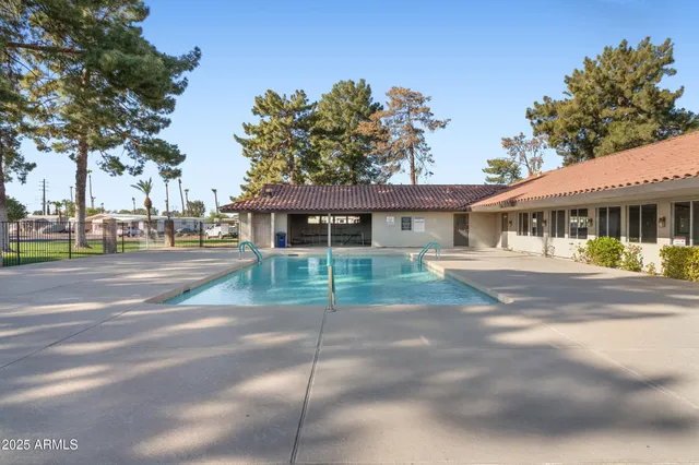 a view of yard with swimming pool