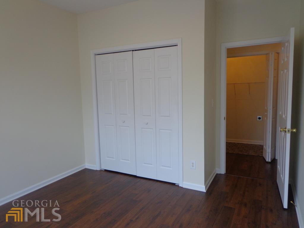 45 Chemin Place Sharpsburg, GA 30277 - Photo 13 of 26 a view of hallway with wooden floor