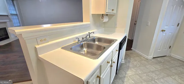 a view of a small space with wooden floor and closet