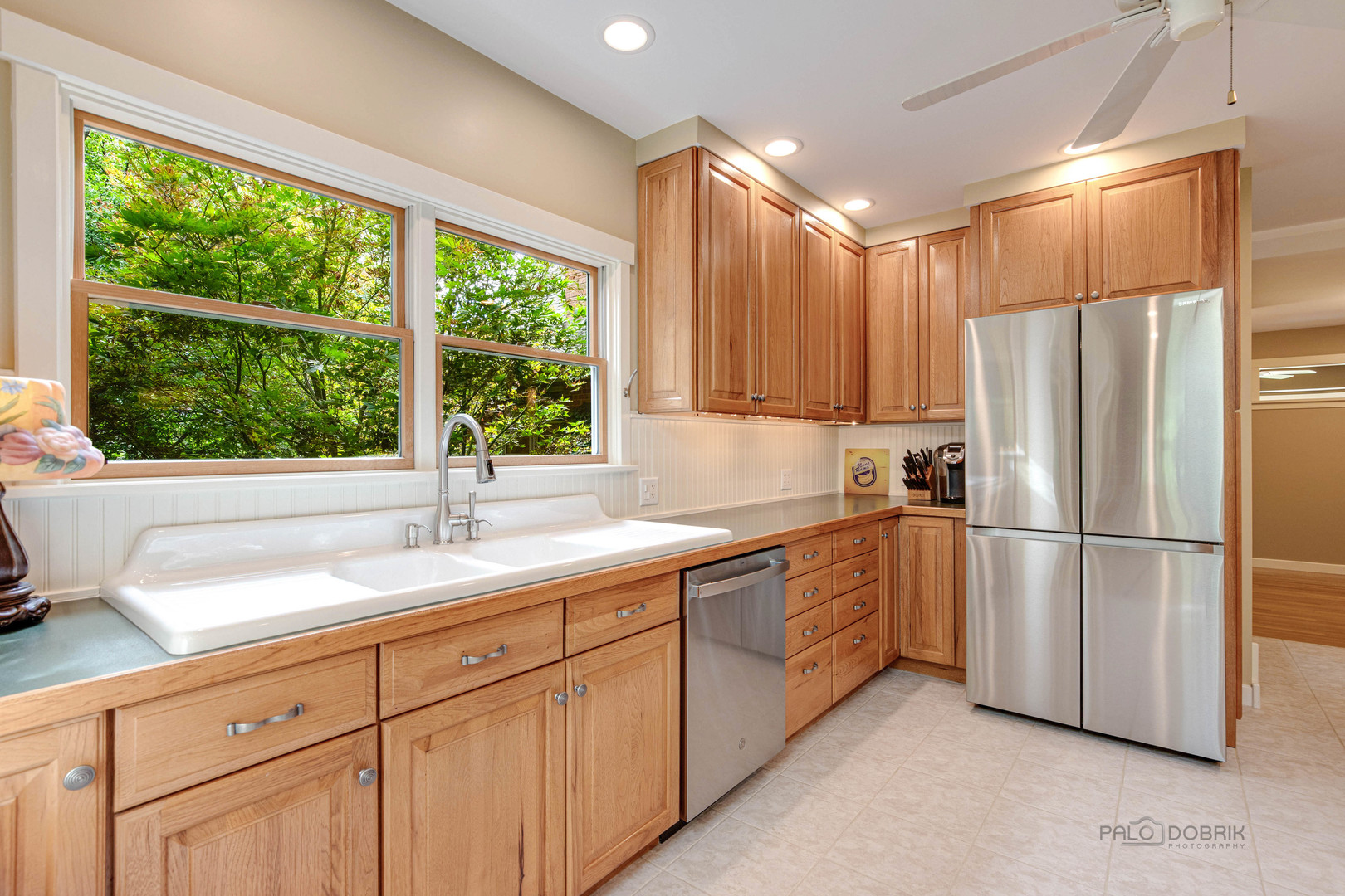 590 West Helen Road Palatine, IL 60067 - Photo 24 of 95 a kitchen with appliances cabinets a sink and a window