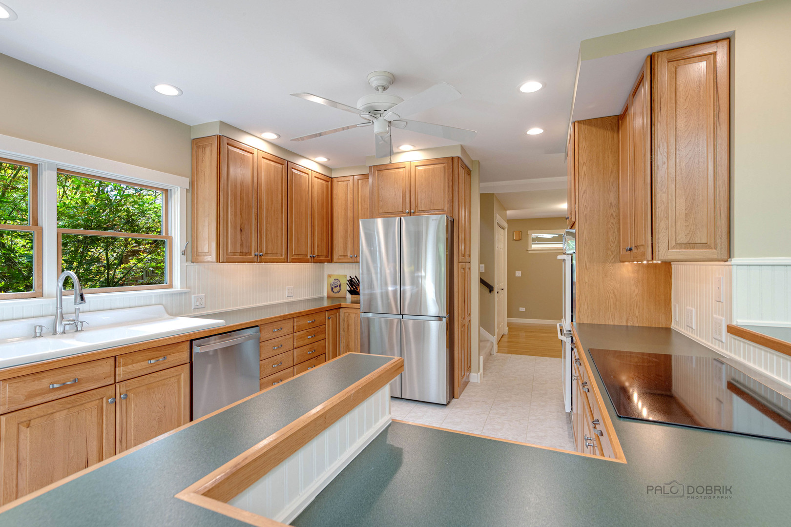 590 West Helen Road Palatine, IL 60067 - Photo 25 of 95 a view of a kitchen with a sink stainless steel appliances and cabinets