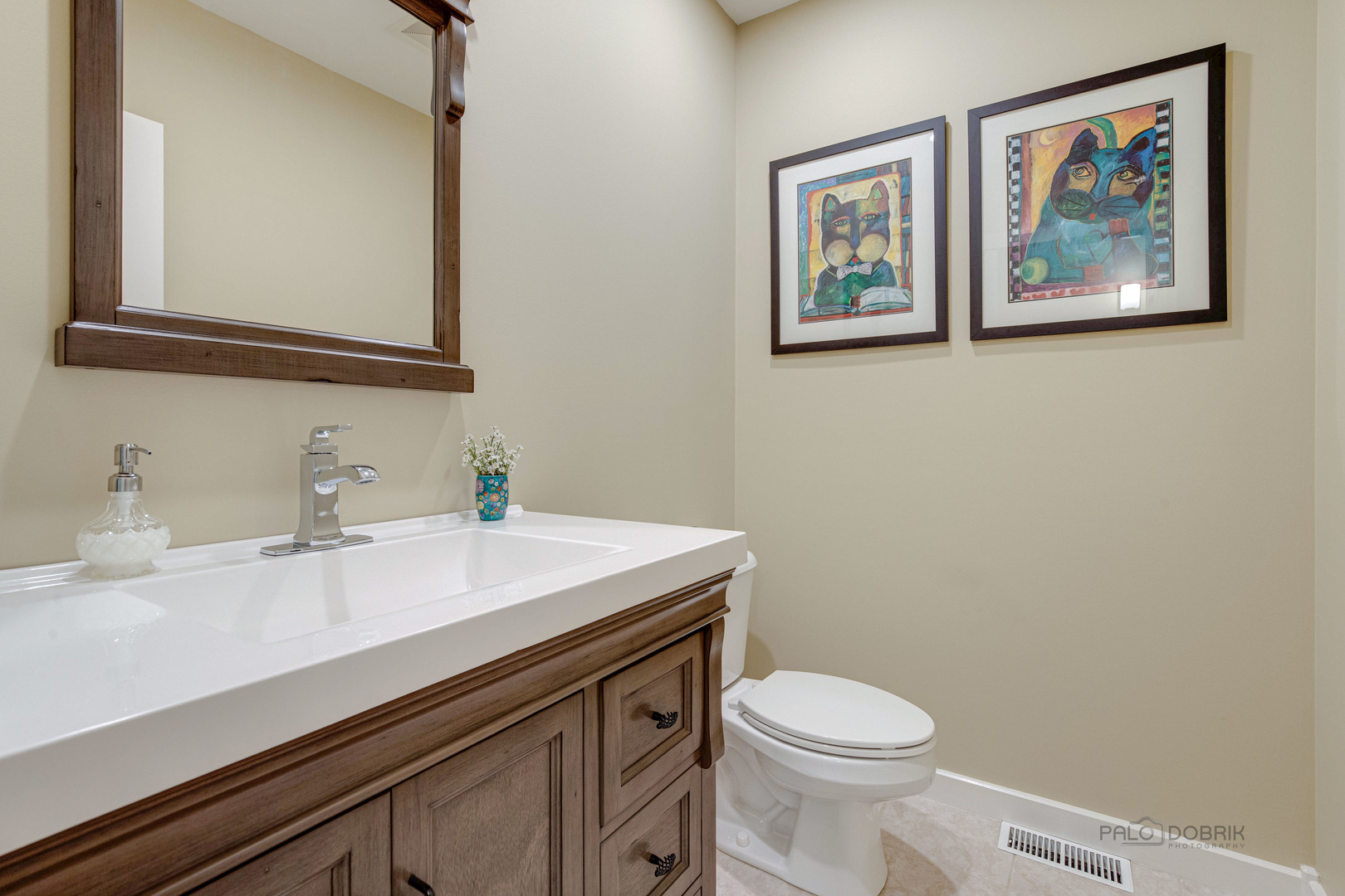 590 West Helen Road Palatine, IL 60067 - Photo 30 of 95 a bathroom with a toilet a sink and mirror