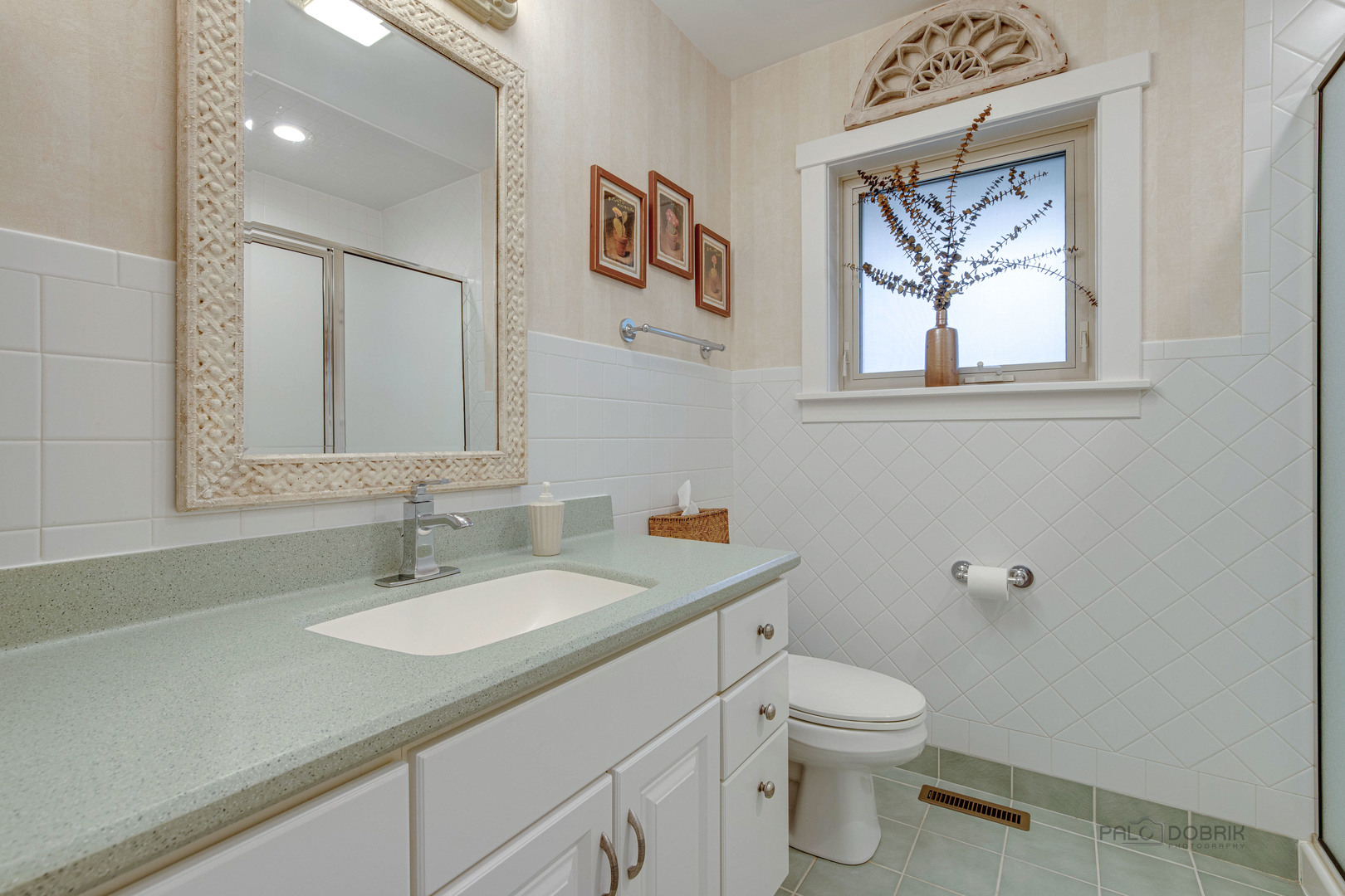 590 West Helen Road Palatine, IL 60067 - Photo 33 of 95 a bathroom with a toilet a sink a mirror and a window