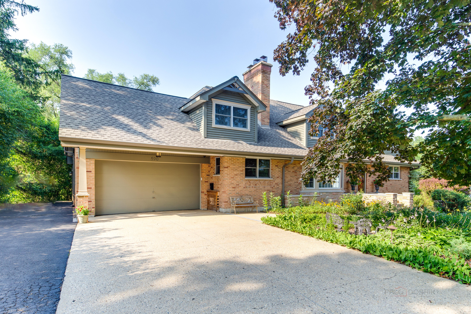 590 West Helen Road Palatine, IL 60067 - Photo 89 of 95 a front view of a house with a yard and garage