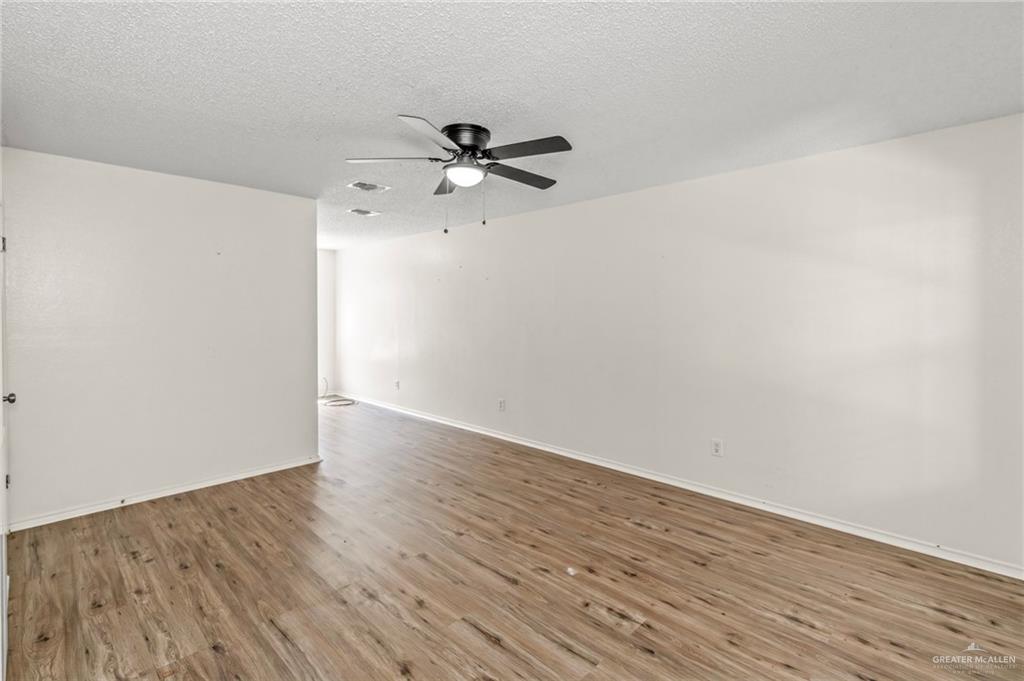 4601 South 24th Street, Unit 3 McAllen, TX 78503 - Photo 2 of 9 wooden floor in an empty room