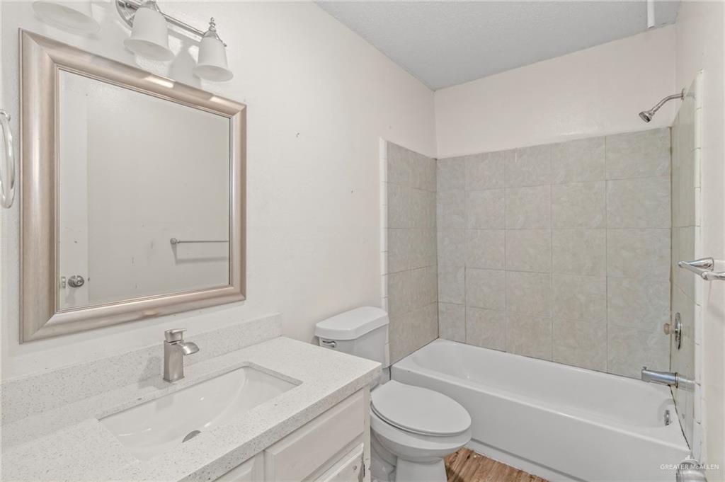4601 South 24th Street, Unit 3 McAllen, TX 78503 - Photo 6 of 9 a bathroom with a sink toilet and shower