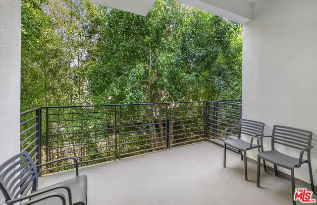 a balcony with chairs