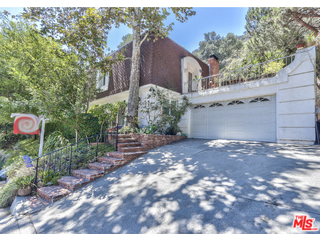 1467 Roscomare Road Los Angeles, CA 90077 - Photo 3 of 19 a view of a house with a yard