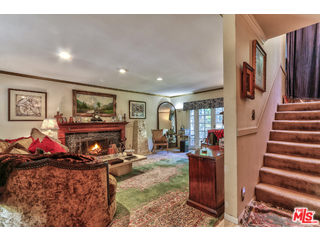 1467 Roscomare Road Los Angeles, CA 90077 - Photo 4 of 19 a living room with furniture and a flat screen tv