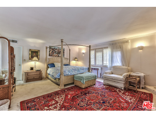1467 Roscomare Road Los Angeles, CA 90077 - Photo 7 of 19 a living room with furniture and a table