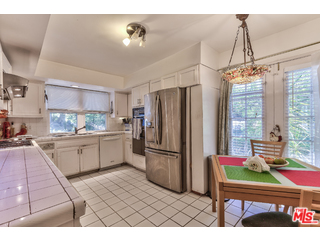 1467 Roscomare Road Los Angeles, CA 90077 - Photo 9 of 19 a kitchen with furniture and a window
