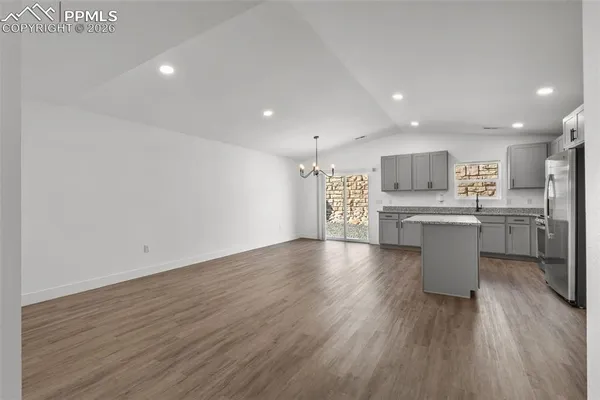 a view of kitchen with cabinets and stainless steel appliances