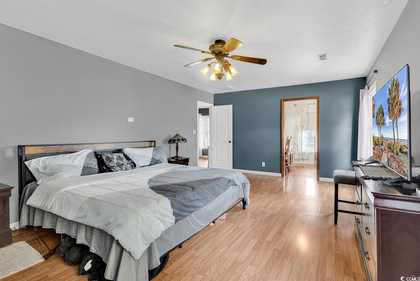 4 Plantation Road Myrtle Beach, SC 29588 - Photo 16 of 40 Bedroom with light wood-style floors and ceiling fan