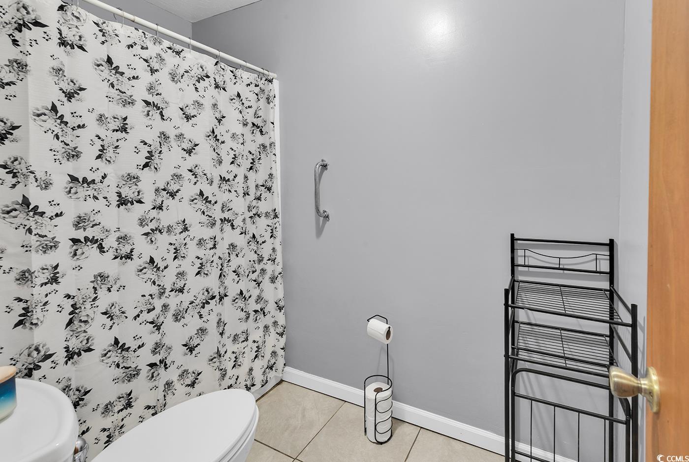 4 Plantation Road Myrtle Beach, SC 29588 - Photo 20 of 40 Full bathroom featuring light tile patterned floors and a stall shower