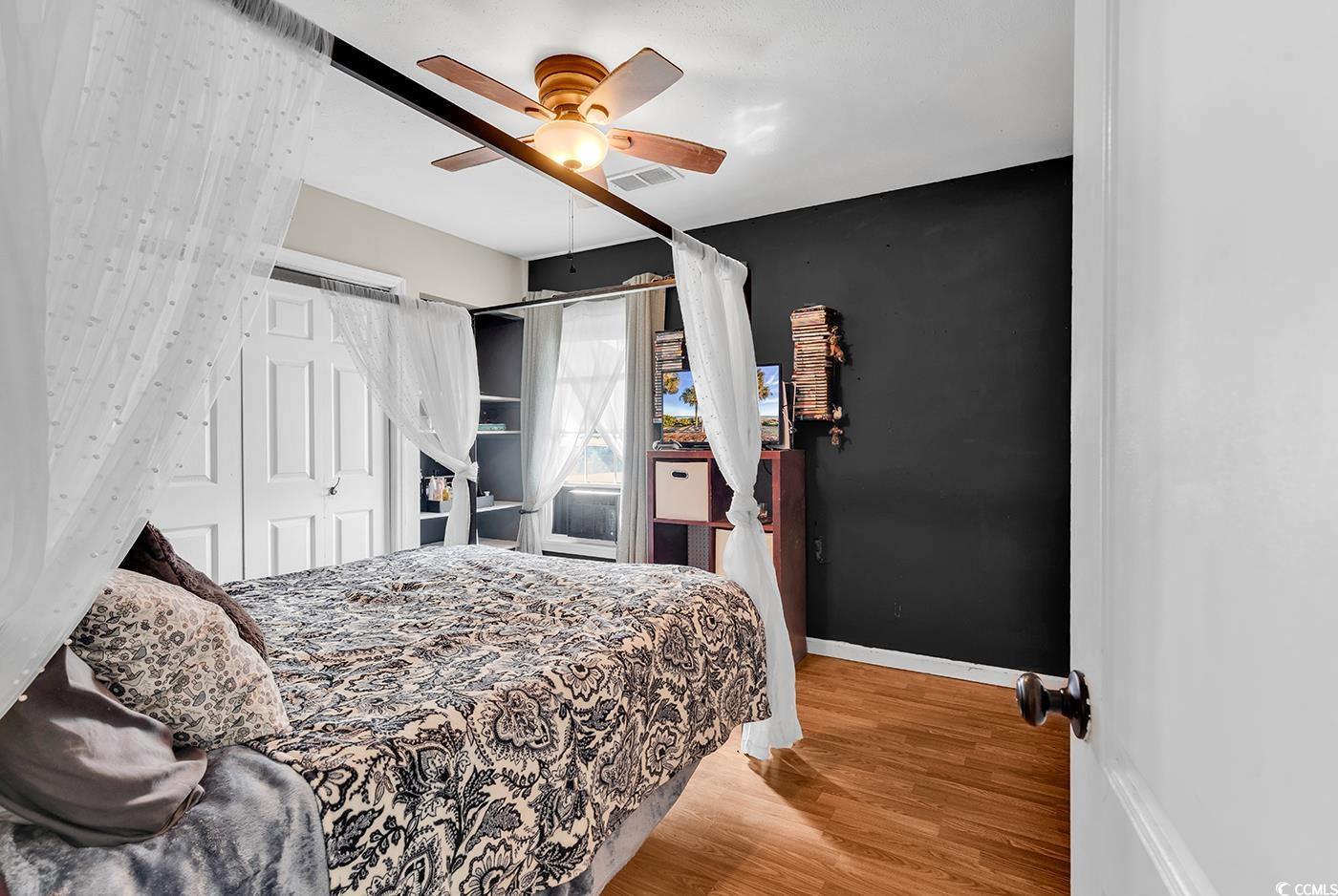 4 Plantation Road Myrtle Beach, SC 29588 - Photo 23 of 40 Bedroom with wood finished floors and ceiling fan