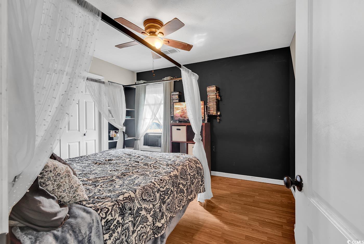 4 Plantation Road Myrtle Beach, SC 29588 - Photo 24 of 40 Bedroom featuring wood finished floors and a ceiling fan