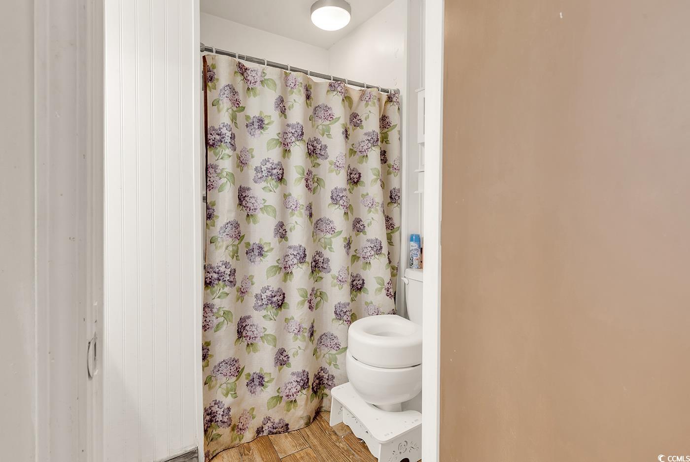 4 Plantation Road Myrtle Beach, SC 29588 - Photo 28 of 40 Full bathroom featuring wood finished floors and curtained shower