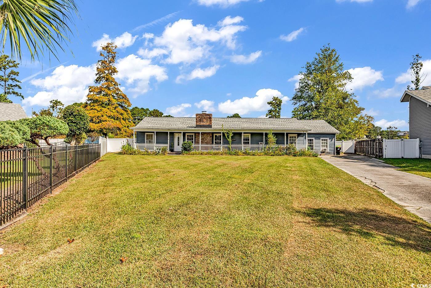 4 Plantation Road Myrtle Beach, SC 29588 - Photo 40 of 40 Single story home featuring a chimney and concrete driveway