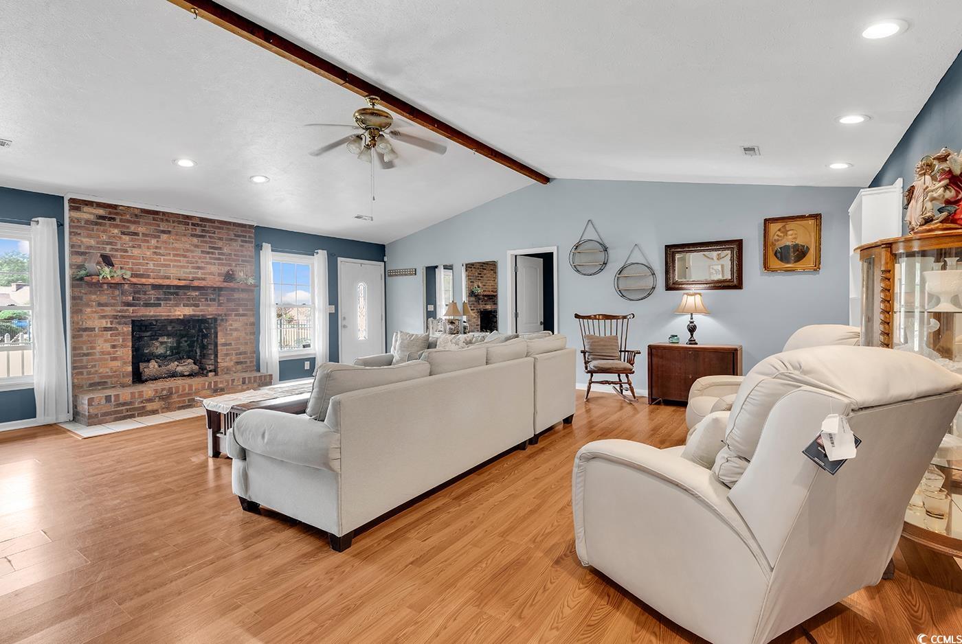 4 Plantation Road Myrtle Beach, SC 29588 - Photo 6 of 40 Living area with recessed lighting, light wood-style floors, a brick fireplace, and ceiling fan