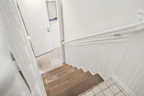 a view of staircase with white walls