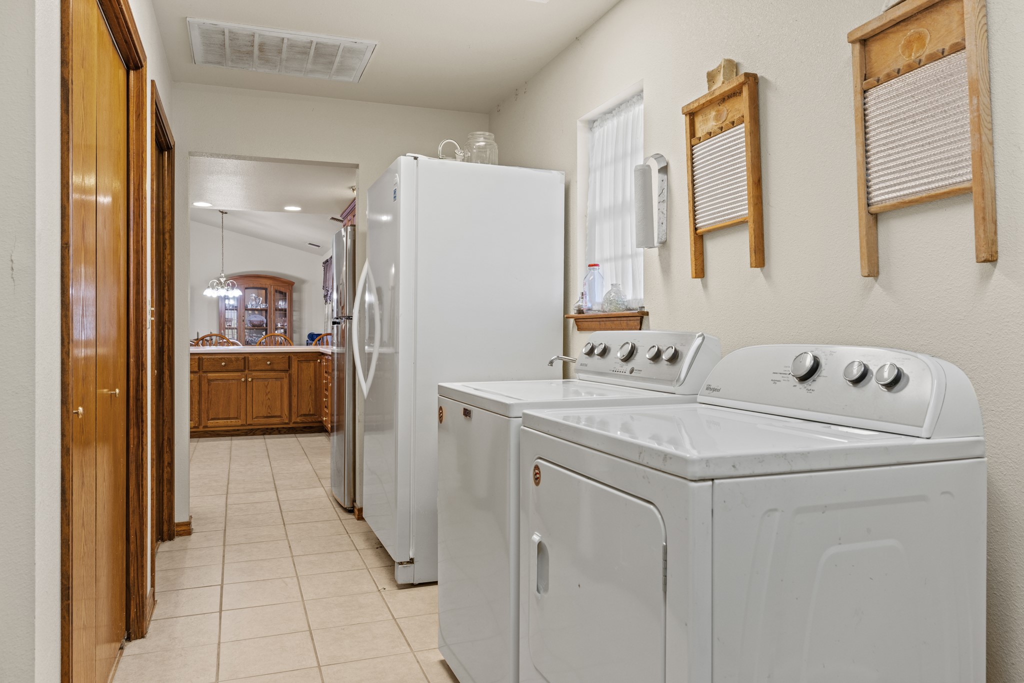 2020 Wendel Road Harper, TX 78631 - Photo 15 of 40 Laundry area featuring washer and dryer and light tile patterned floors