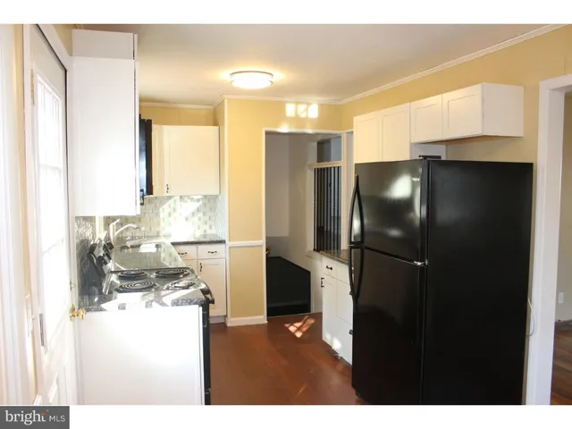 a kitchen with refrigerator and countertop