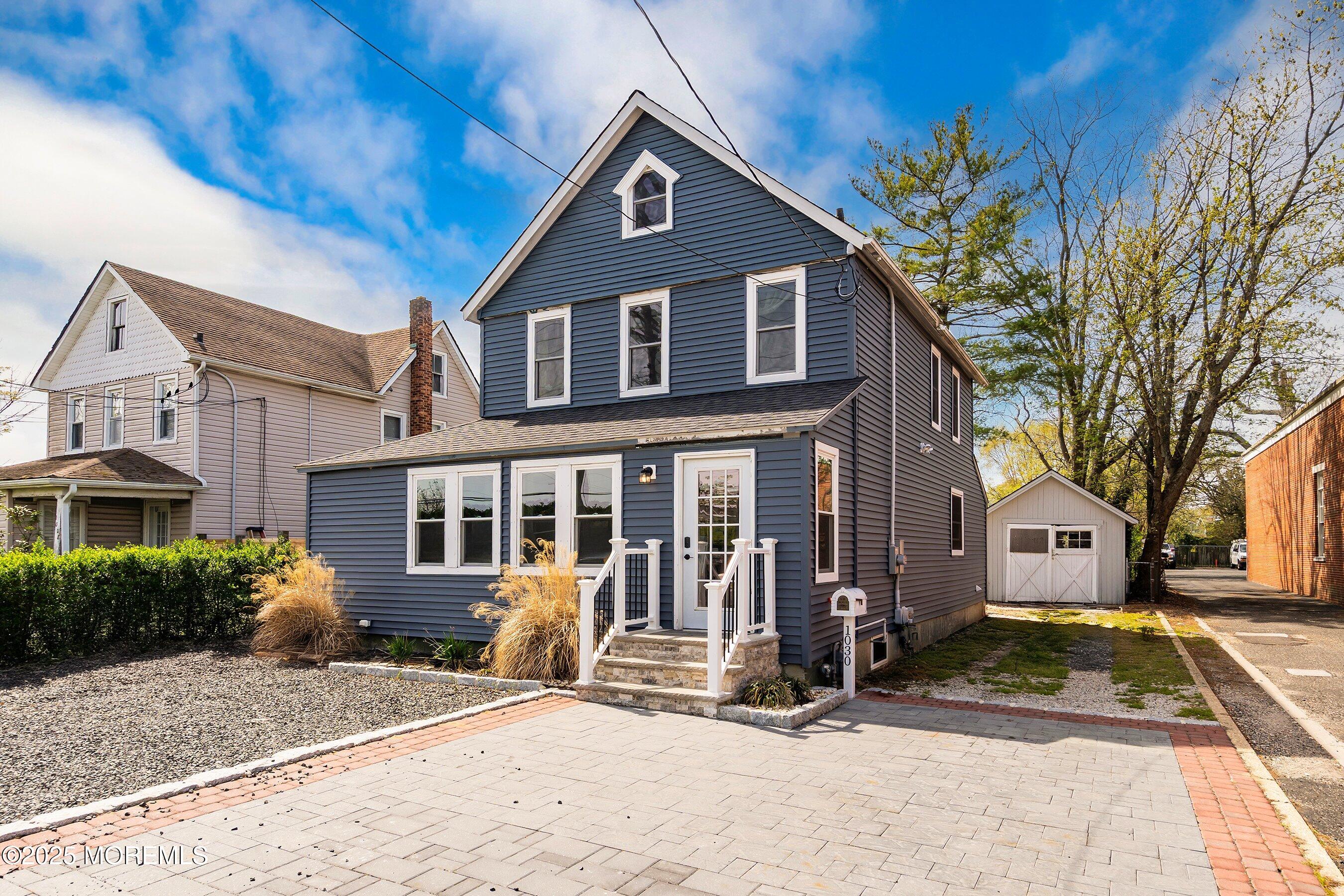 1030 Ocean Road Point Pleasant, NJ 08742 - Photo 1 of 45 a front view of a house with a yard