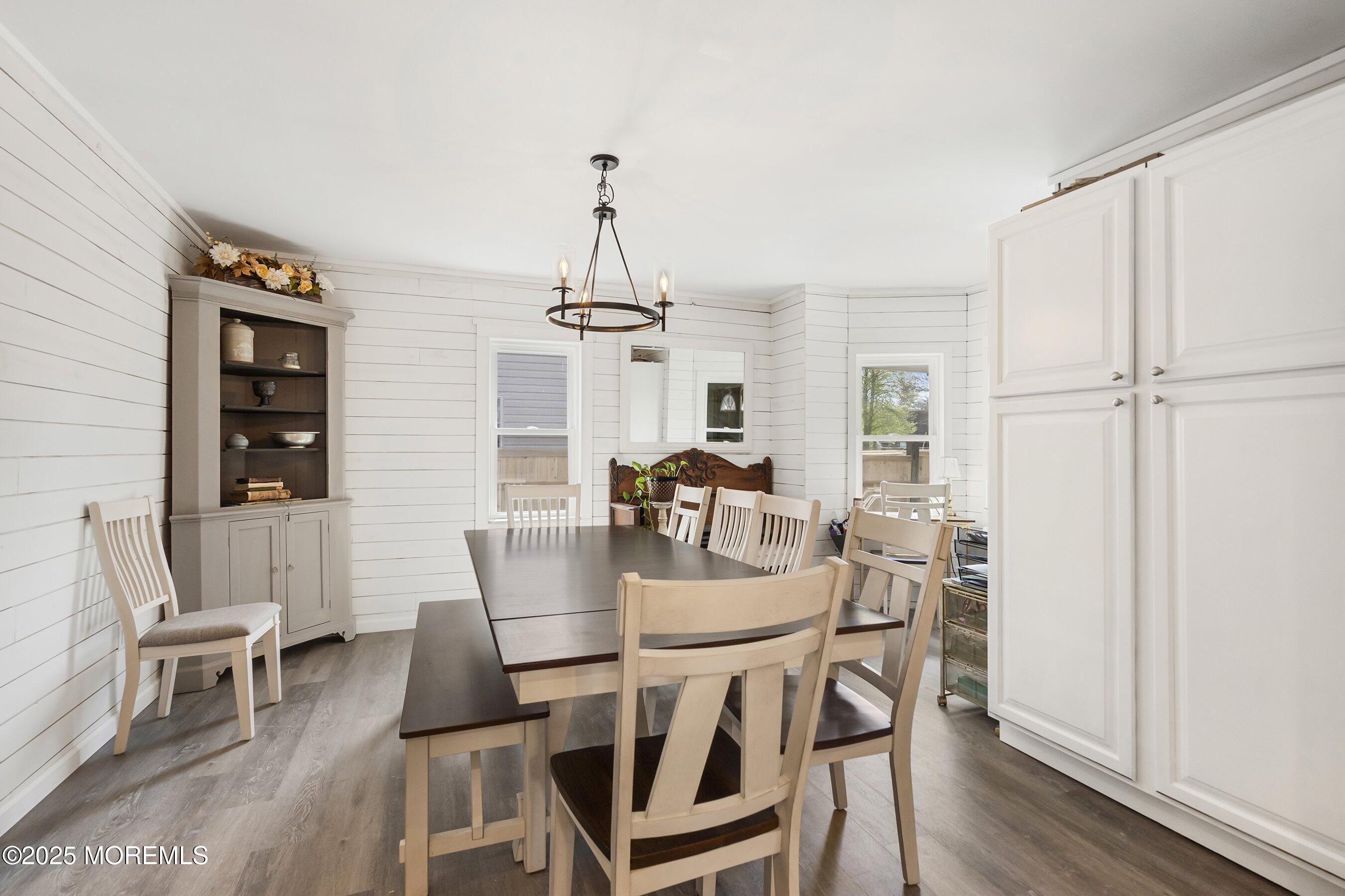 1030 Ocean Road Point Pleasant, NJ 08742 - Photo 13 of 45 a view of a dining room with furniture and wooden floor