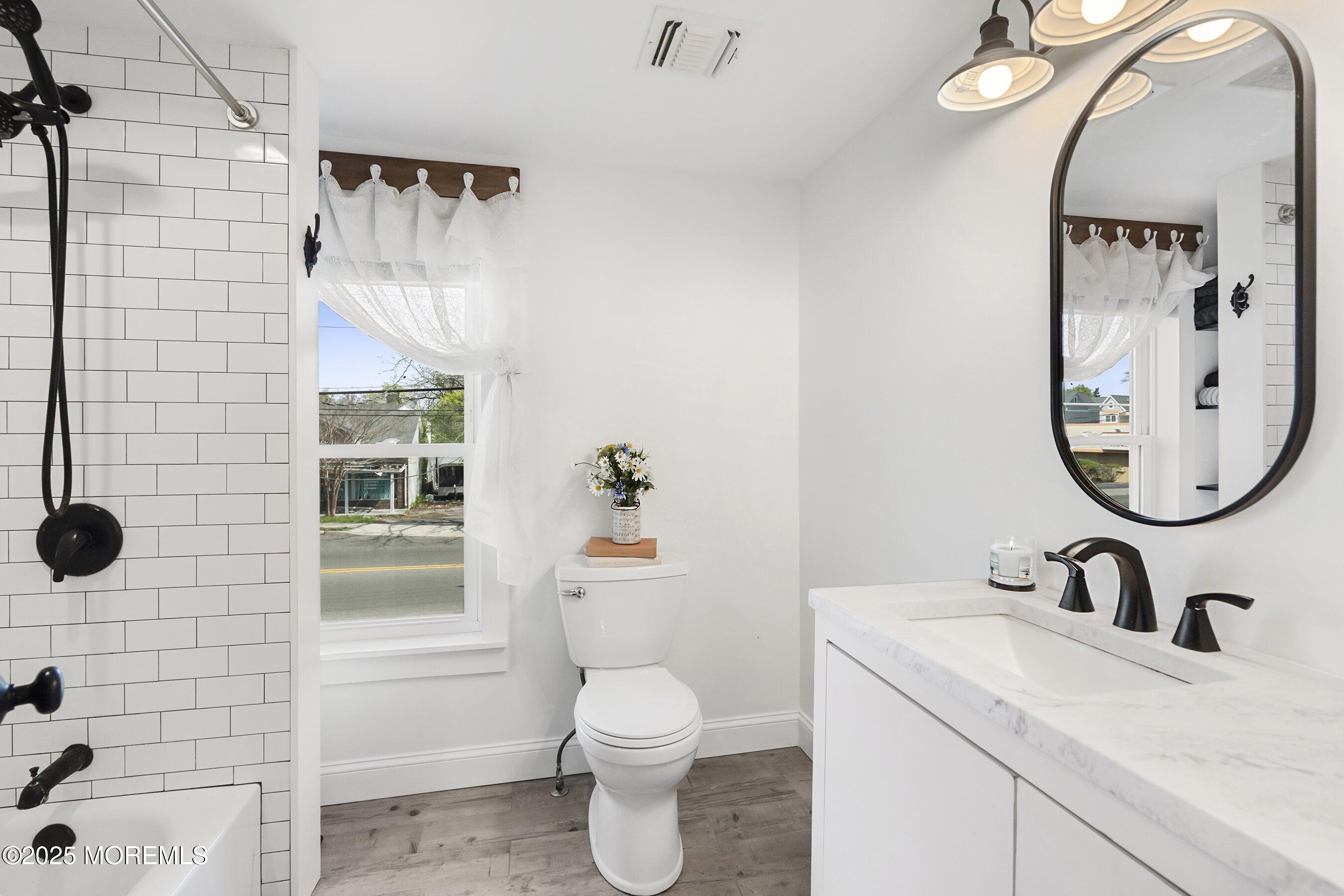 1030 Ocean Road Point Pleasant, NJ 08742 - Photo 16 of 45 a bathroom with a sink toilet and shower