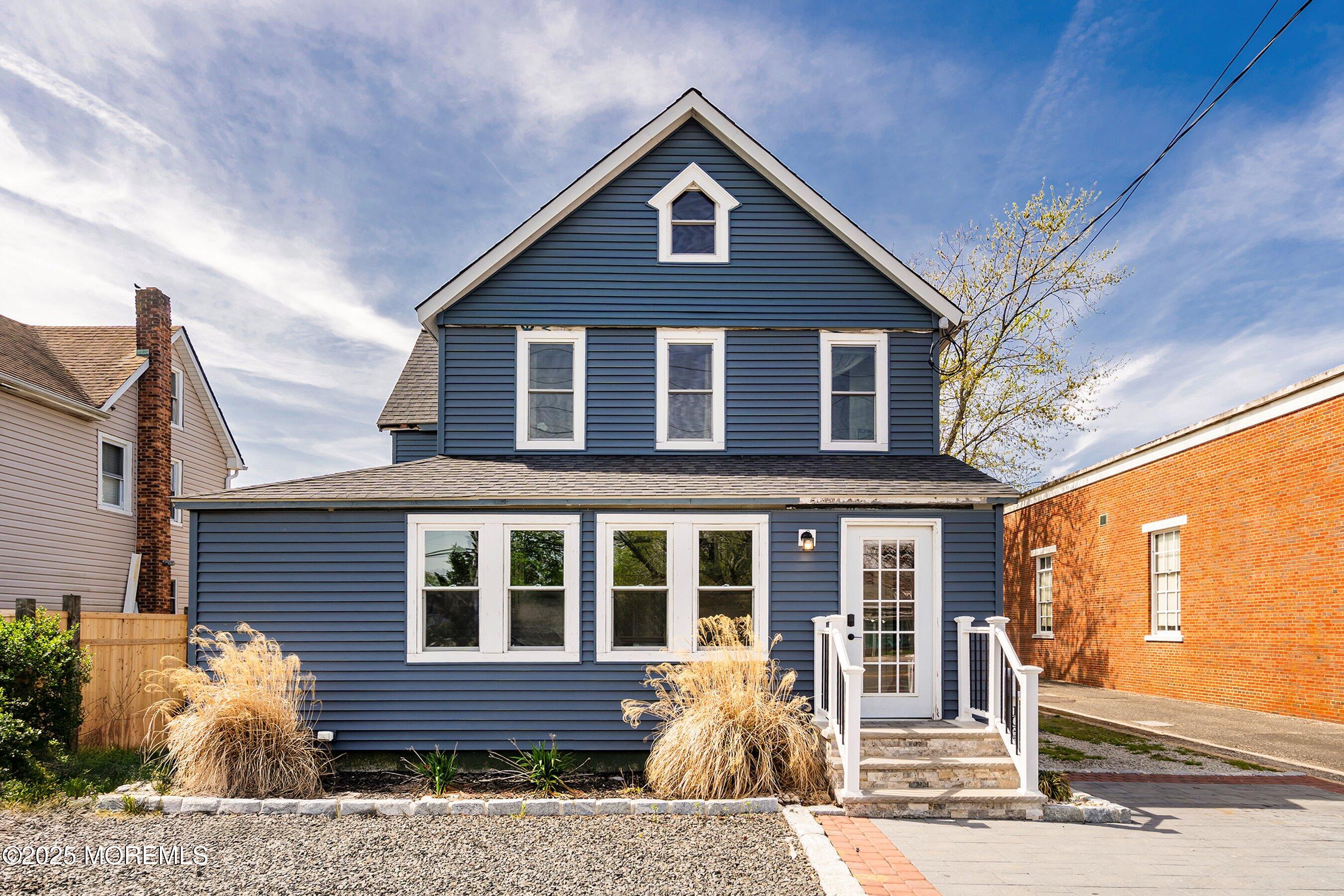 1030 Ocean Road Point Pleasant, NJ 08742 - Photo 2 of 45 a front view of a house with a yard