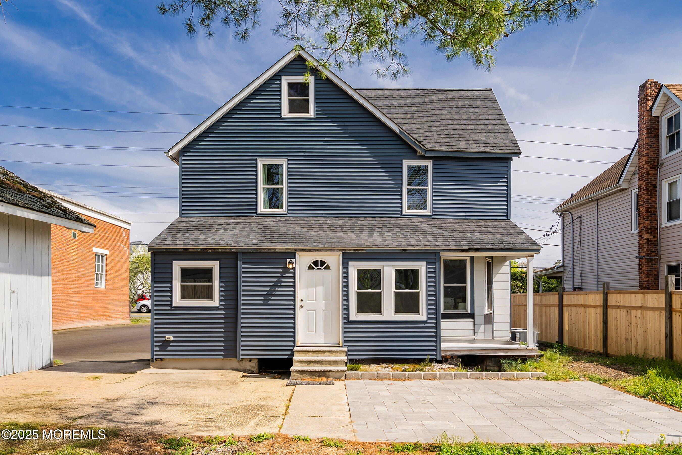 1030 Ocean Road Point Pleasant, NJ 08742 - Photo 21 of 45 a front view of a house with a yard