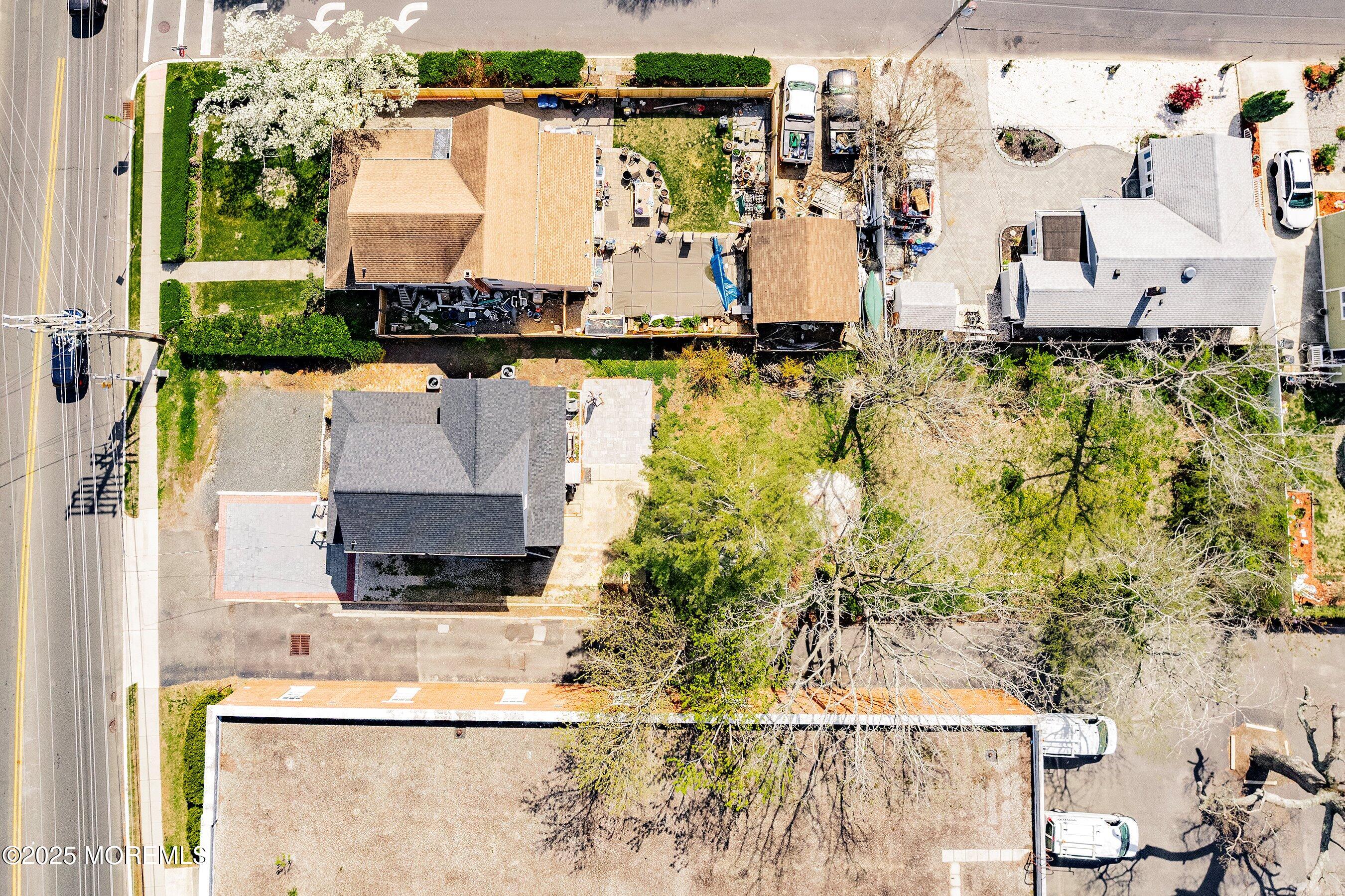 1030 Ocean Road Point Pleasant, NJ 08742 - Photo 26 of 45 an aerial view of a house with a yard and large trees