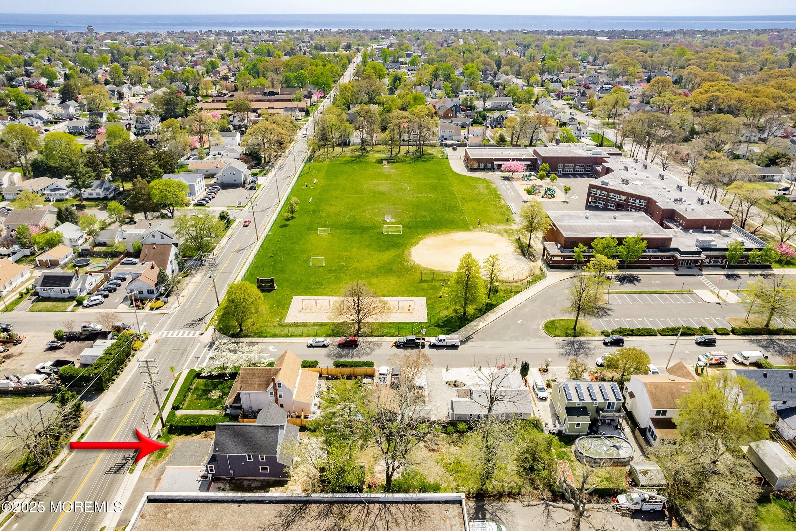 1030 Ocean Road Point Pleasant, NJ 08742 - Photo 35 of 45 an aerial view of residential houses with outdoor space and swimming pool
