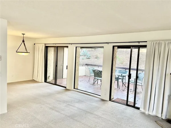 a view of a room with large windows