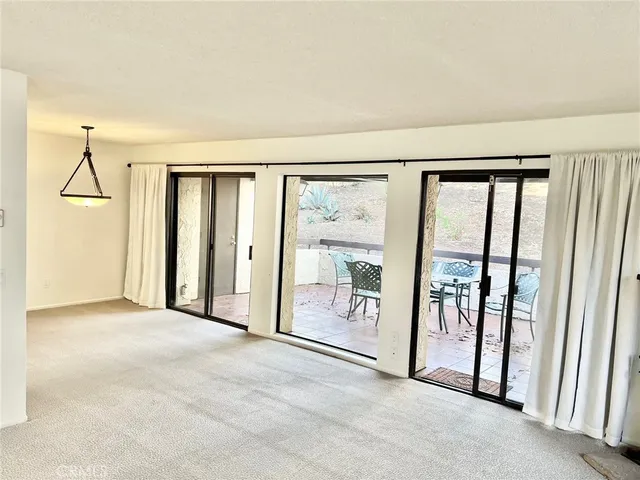 a view of a room with large windows