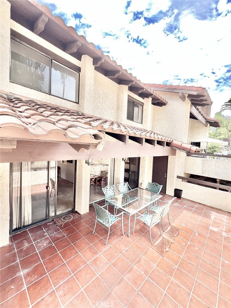 35 Cabrillo Drive Avalon, CA 90704 - Photo 18 of 40 a view of a patio with a table and chairs