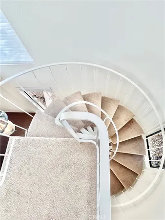 a view of staircase with white walls
