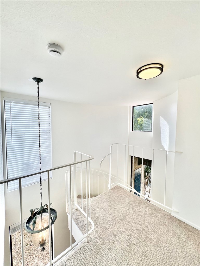 35 Cabrillo Drive Avalon, CA 90704 - Photo 22 of 40 a view of a livingroom with furniture staircase and a ceiling fan