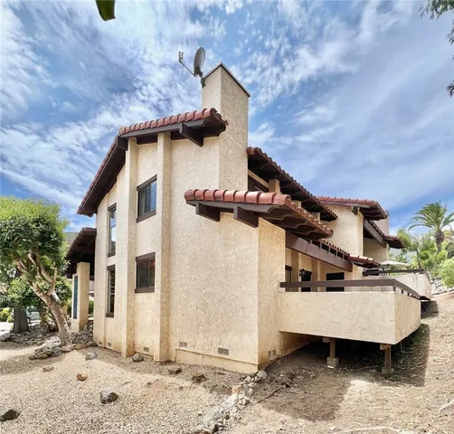 a front view of a house with parking space