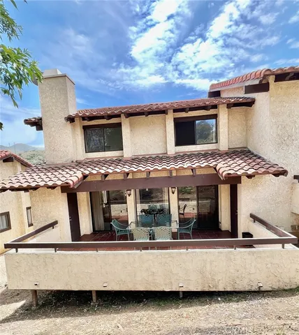 a view of a house with roof deck