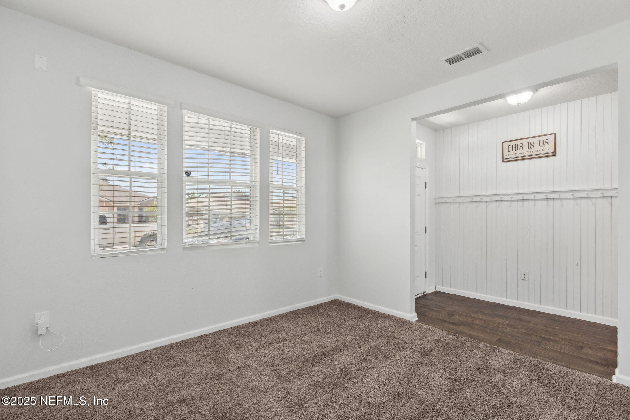 2487 Beachview Drive Jacksonville, FL 32218 - Photo 11 of 39 a view of a livingroom with an empty space and window
