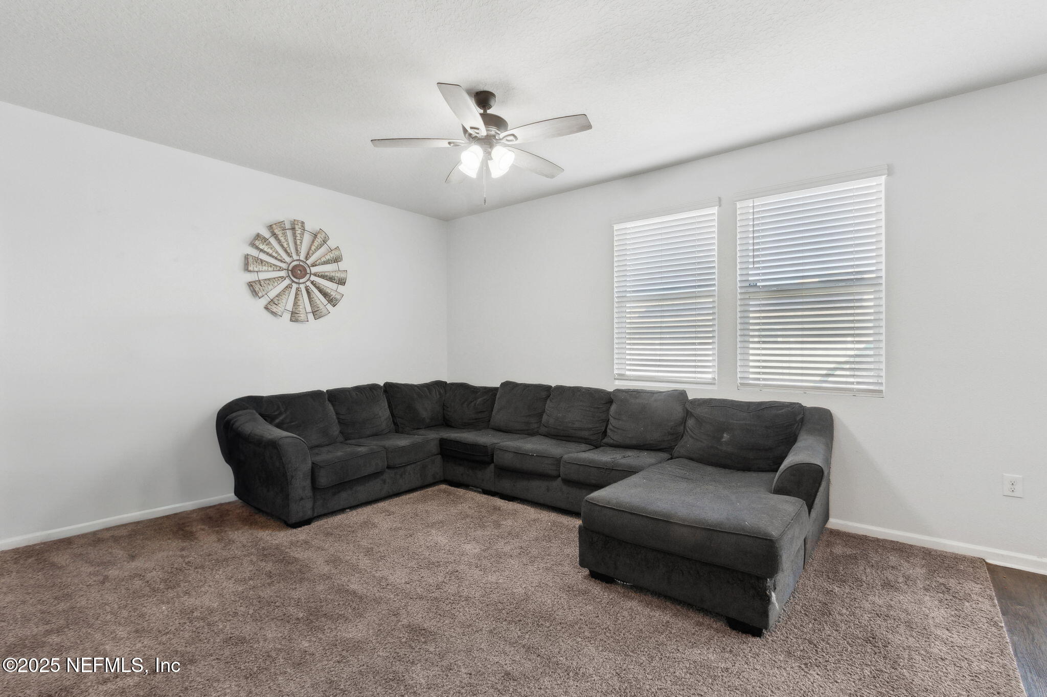 2487 Beachview Drive Jacksonville, FL 32218 - Photo 13 of 39 a living room with furniture and a window